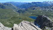 Author : Pierre-joseph G, Comment : La route du Petit-St Bernard sur le versant italien. Å l'arrière plan, le Grand Combin, le Cervin et le Mont Rose. Photo prise du sommet de Lancebranlette, à 2936 m d'altitude. 
